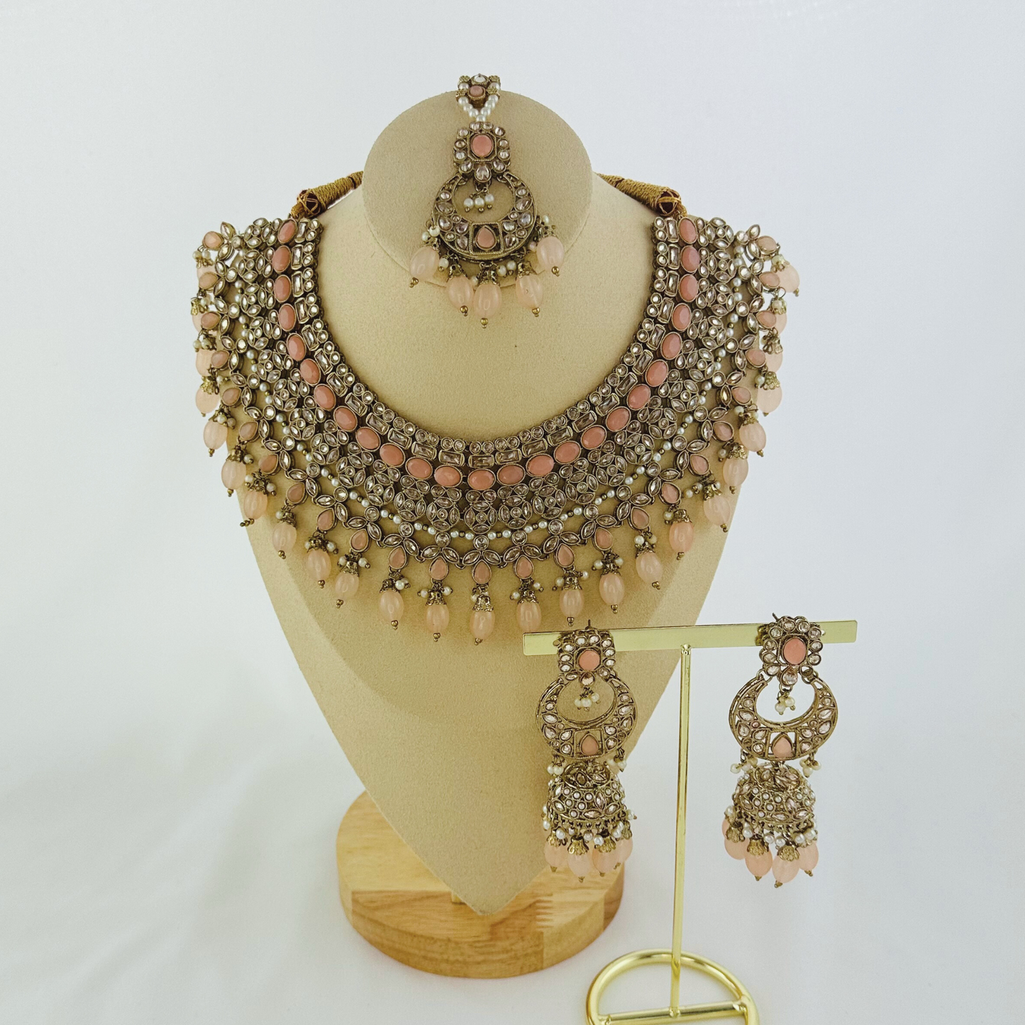 Necklace set with pink bead and stones. Set includes necklace, tikka & earrings. Prefect for Indian weddings, parties and special occasions. Latest 2023 fashion. High end Indian fashion jewellery with top quality stones and beads.