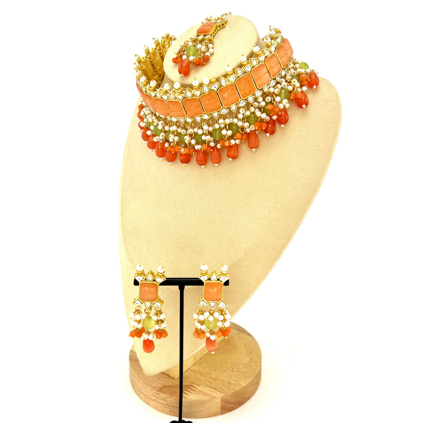 Choker set with with peach, clear stones and green, peach and orange beads, Set includes choker, tikka and earrings. Prefect for Indian weddings, parties and special occasions. Latest 2022 fashion. High end Indian fashion jewellery with top quality stones and beads.