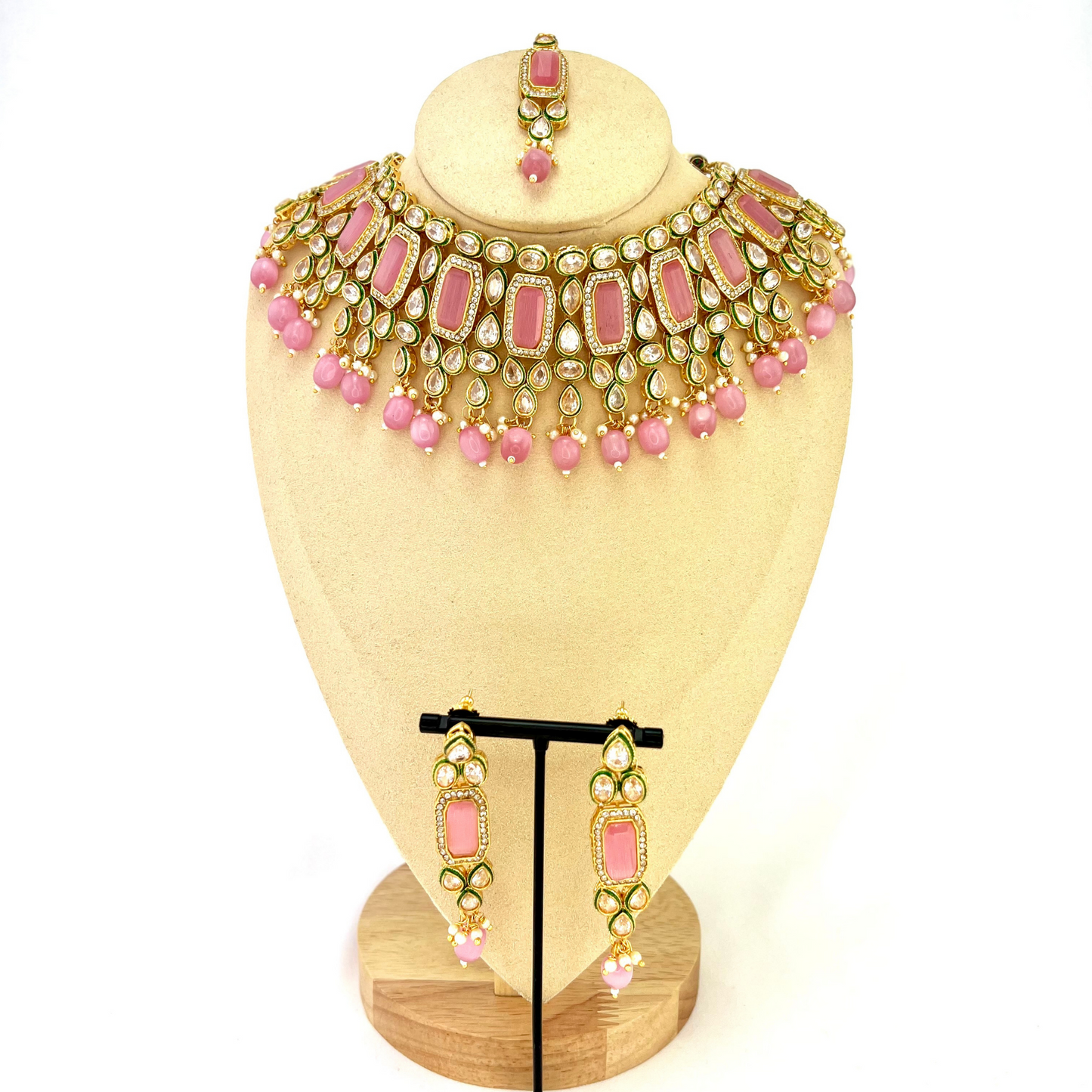 Necklace set with pink beads and clear and pink stones. Set includes necklace, tikka and earrings. Prefect for Indian weddings, parties and special occasions. Latest 2022 fashion. High end Indian fashion jewellery with top quality stones and beads.