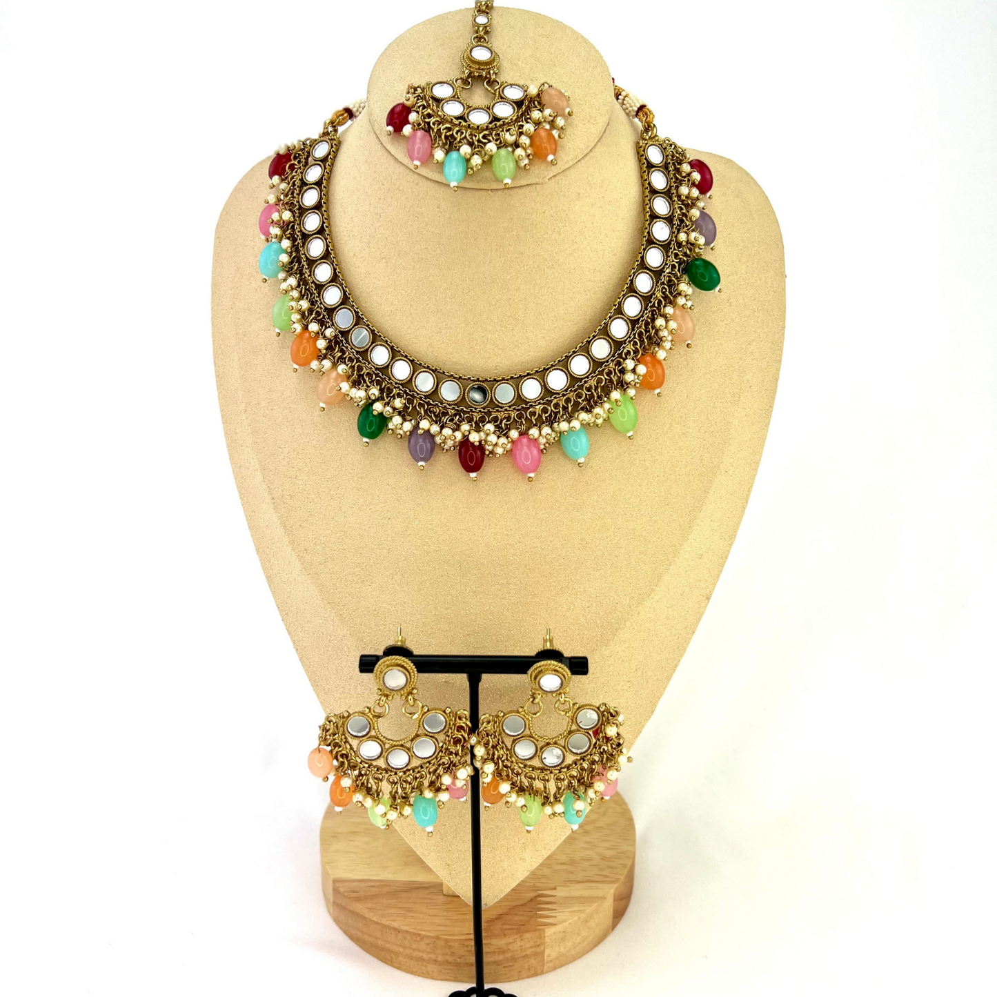 Mirror necklace set with multi colour beads and small pearls. Set includes necklace, tikka and earrings. Prefect for Indian parties, weddings and special occasions. Latest 2022 fashion