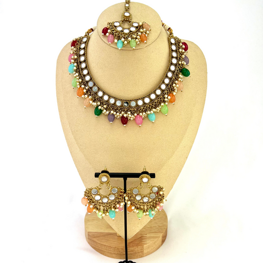 Mirror necklace set with multi colour beads and small pearls. Set includes necklace, tikka and earrings. Prefect for Indian parties, weddings and special occasions. Latest 2022 fashion
