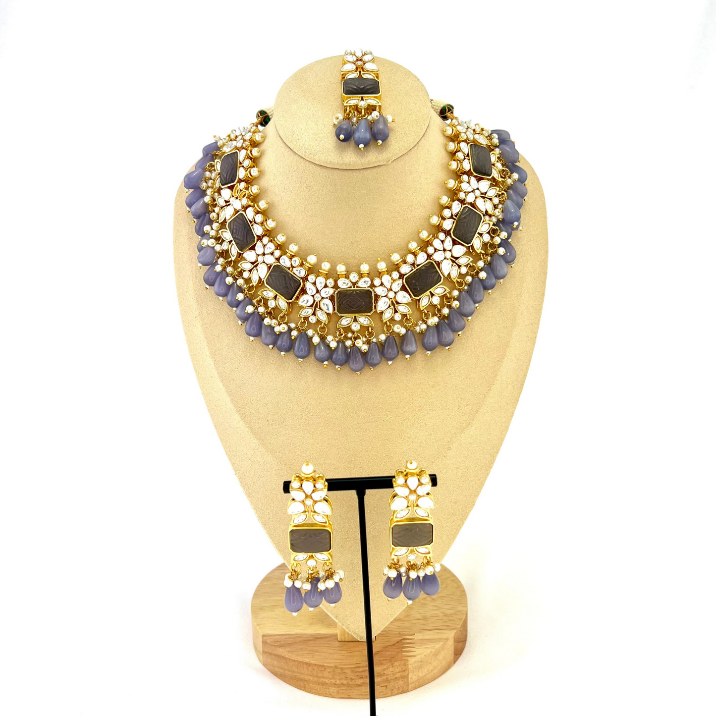 Necklace set with lavender beads, clear and lavender stones. Set includes necklace, tikka & earrings. Prefect for Indian weddings, parties and special occasions. Latest 2022 fashion. High end Indian fashion jewellery with top quality stones and beads.