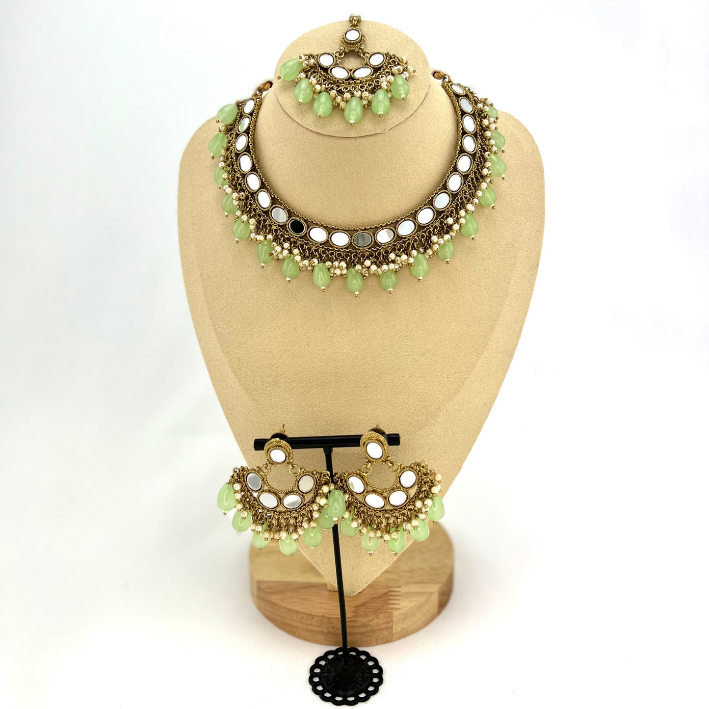 Mirror necklace set with green beads and small white pearls. Set includes necklace, tikka and earrings. Prefect for Indian parties, weddings and special occasions. Latest 2022 fashion.