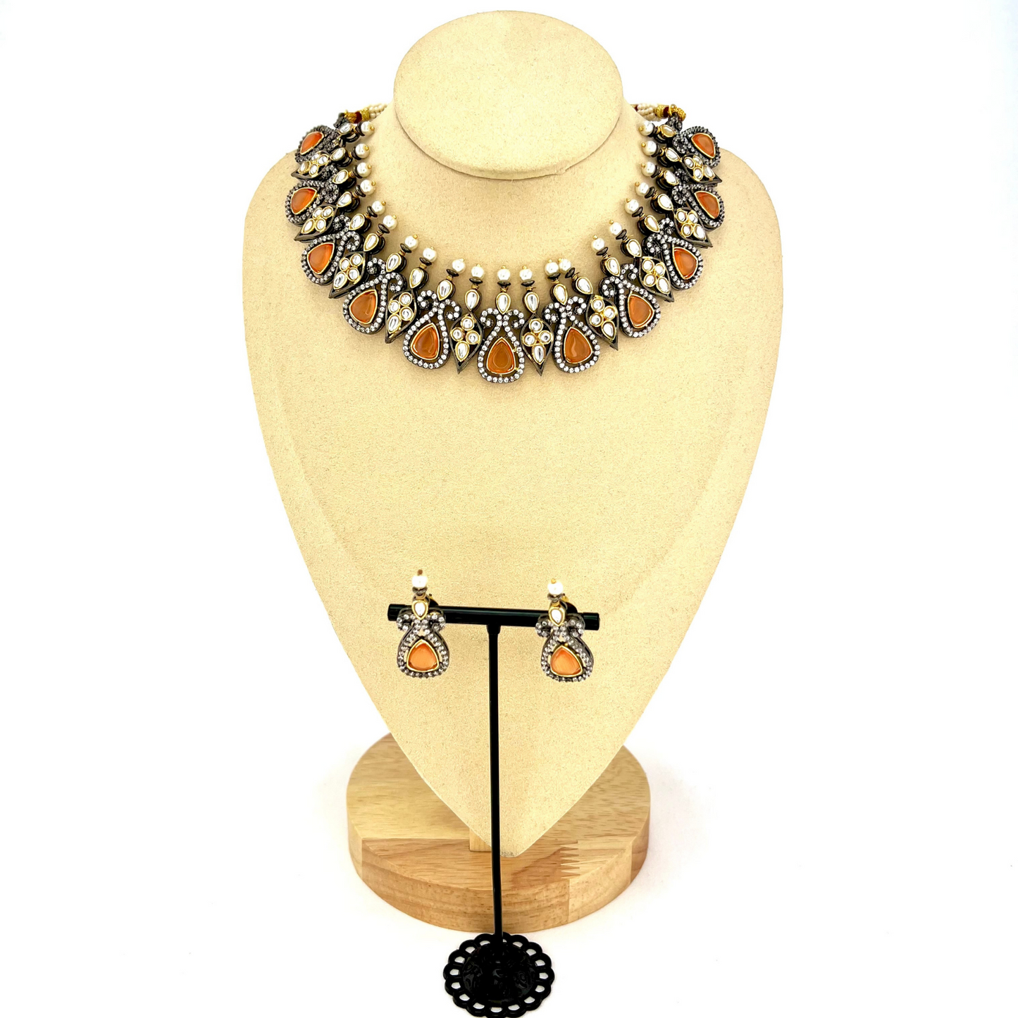 Necklace set with peach and clear stone work. Set includes necklace and earrings. Prefect for Indian weddings, parties and special occasions. Latest 2022 fashion. High end Indian fashion jewellery with top quality stones and beads.