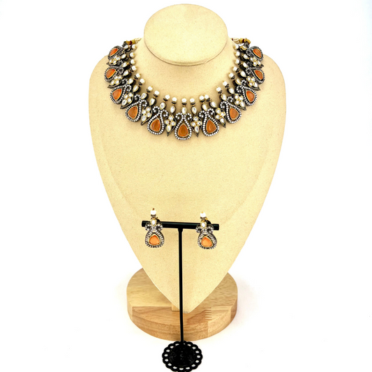 Necklace set with peach and clear stone work. Set includes necklace and earrings. Prefect for Indian weddings, parties and special occasions. Latest 2022 fashion. High end Indian fashion jewellery with top quality stones and beads.