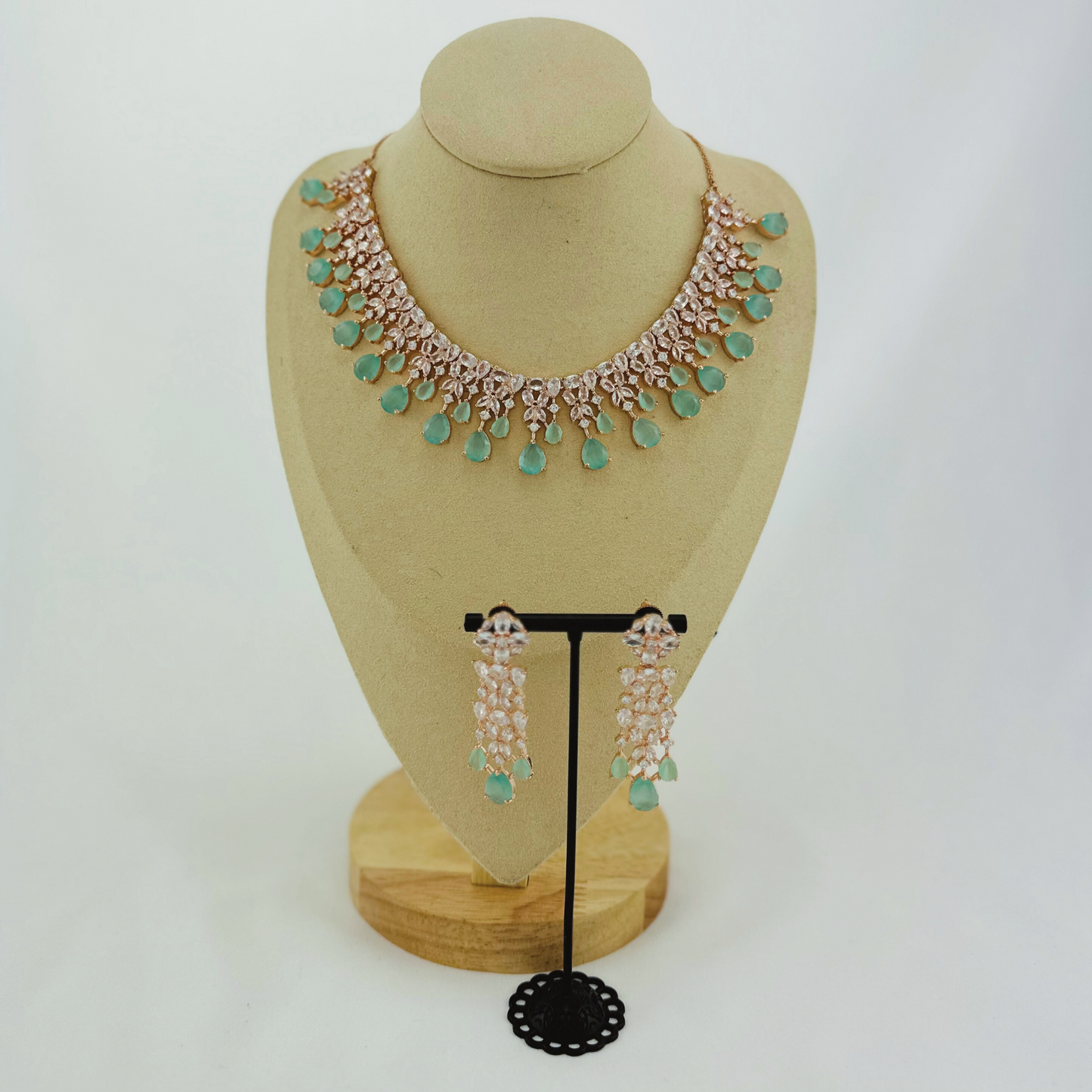 Rosegold necklace set with light blue and clear stones. Set includes necklace & earrings. Prefect for Indian weddings, parties and special occasions. Latest 2023 fashion. High end Indian fashion jewellery with top quality stones and beads.