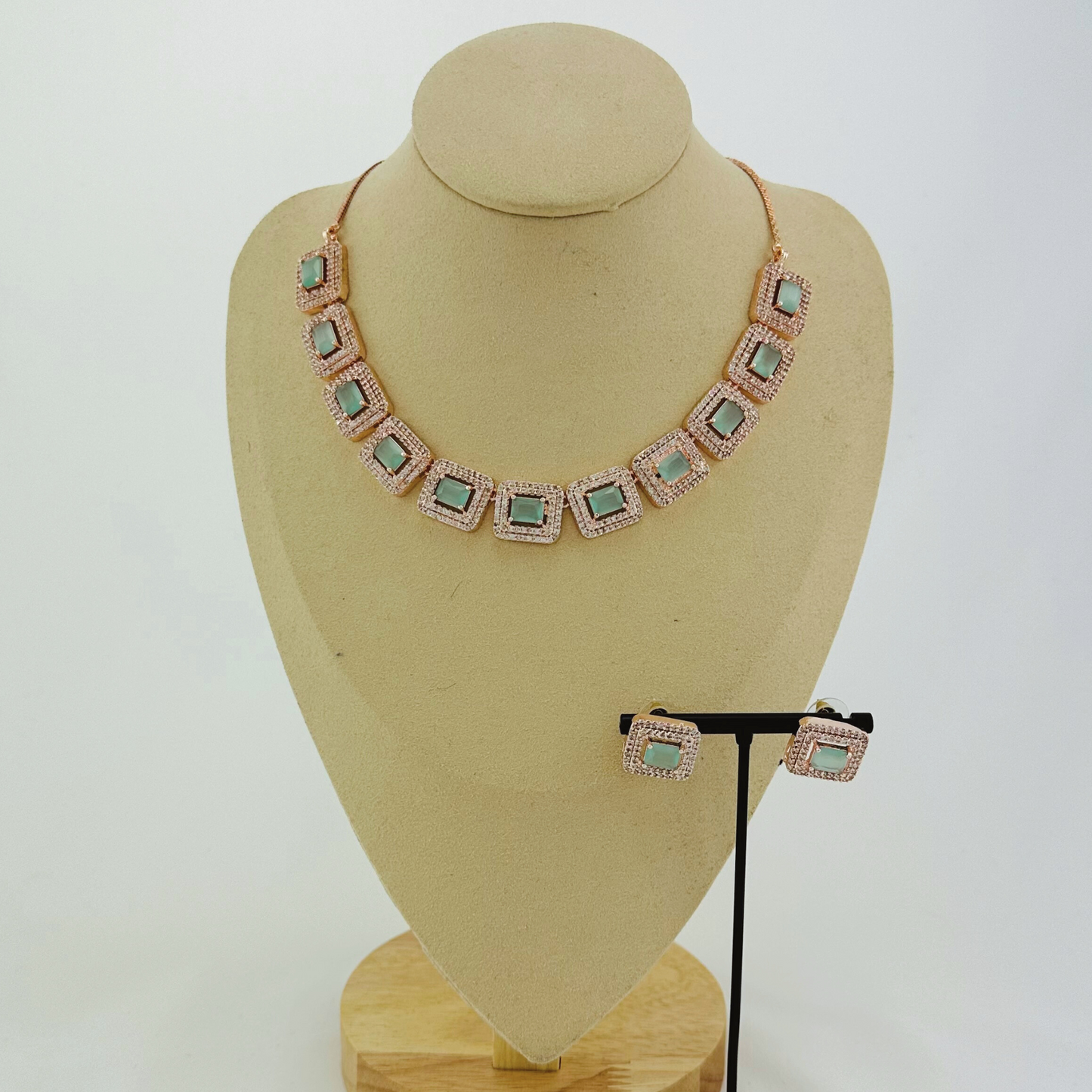 Rosegold necklace set with light blue and clear stones. Set includes necklace & earrings. Prefect for Indian weddings, parties and special occasions. Latest 2023 fashion. High end Indian fashion jewellery with top quality stones and beads.