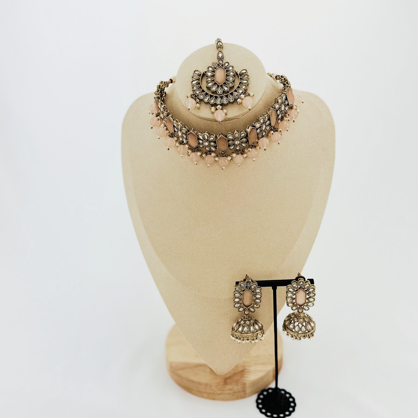 Choker set with baby pink beads and stones. Set includes necklace, tikka & earrings. Prefect for Indian weddings, parties and special occasions. Latest 2023 fashion. High end Indian fashion jewellery with top quality stones and beads.