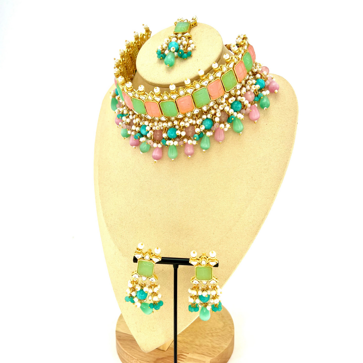 Choker set with with pink, green, clear stones and green, pink and blue beads. Set includes choker, tikka and earrings. Prefect for Indian weddings, parties and special occasions. Latest 2022 fashion. High end Indian fashion jewellery with top quality stones and beads.