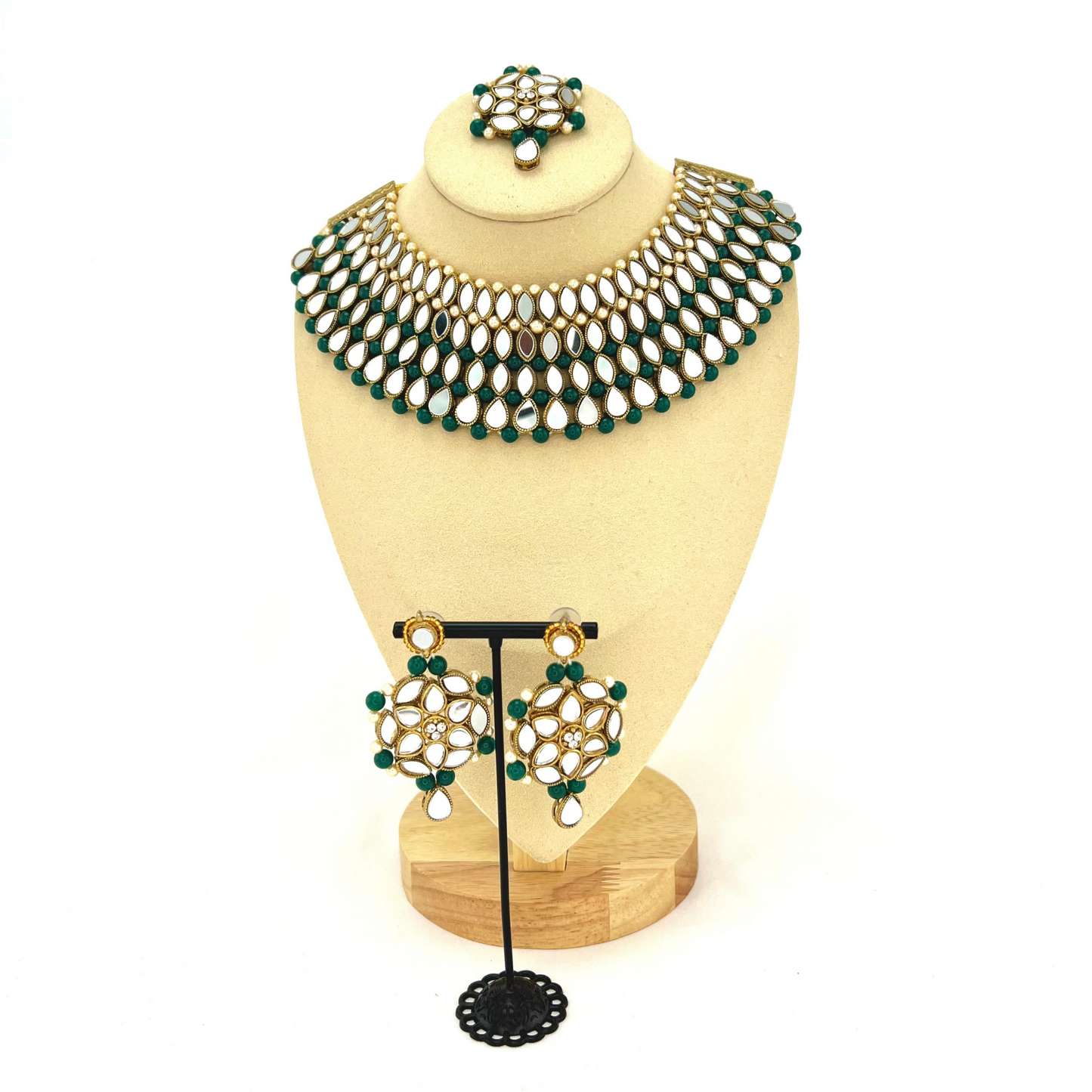 Mirror necklace set with forest green beads, clear stones and pearls. Set includes, necklace, tikka and earrings. Prefect for Indian weddings, parties and special occasions. Latest 2022 fashion. High end Indian fashion jewellery with top quality stones and beads.