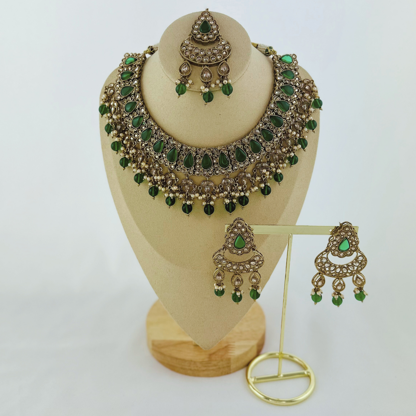 Necklace set with green beads and stone. Set includes necklace, tikka & earrings. Prefect for Indian weddings, parties and special occasions. Latest 2023 fashion. High end Indian fashion jewellery with top quality stones and beads.