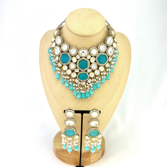Kundan necklace set with with clear and blue stones, blue beads and small white pearls. Set includes necklace and earrings. Prefect for Indian weddings, parties and special occasions. Latest 2022 fashion. High end Indian fashion jewellery with top quality stones and beads.