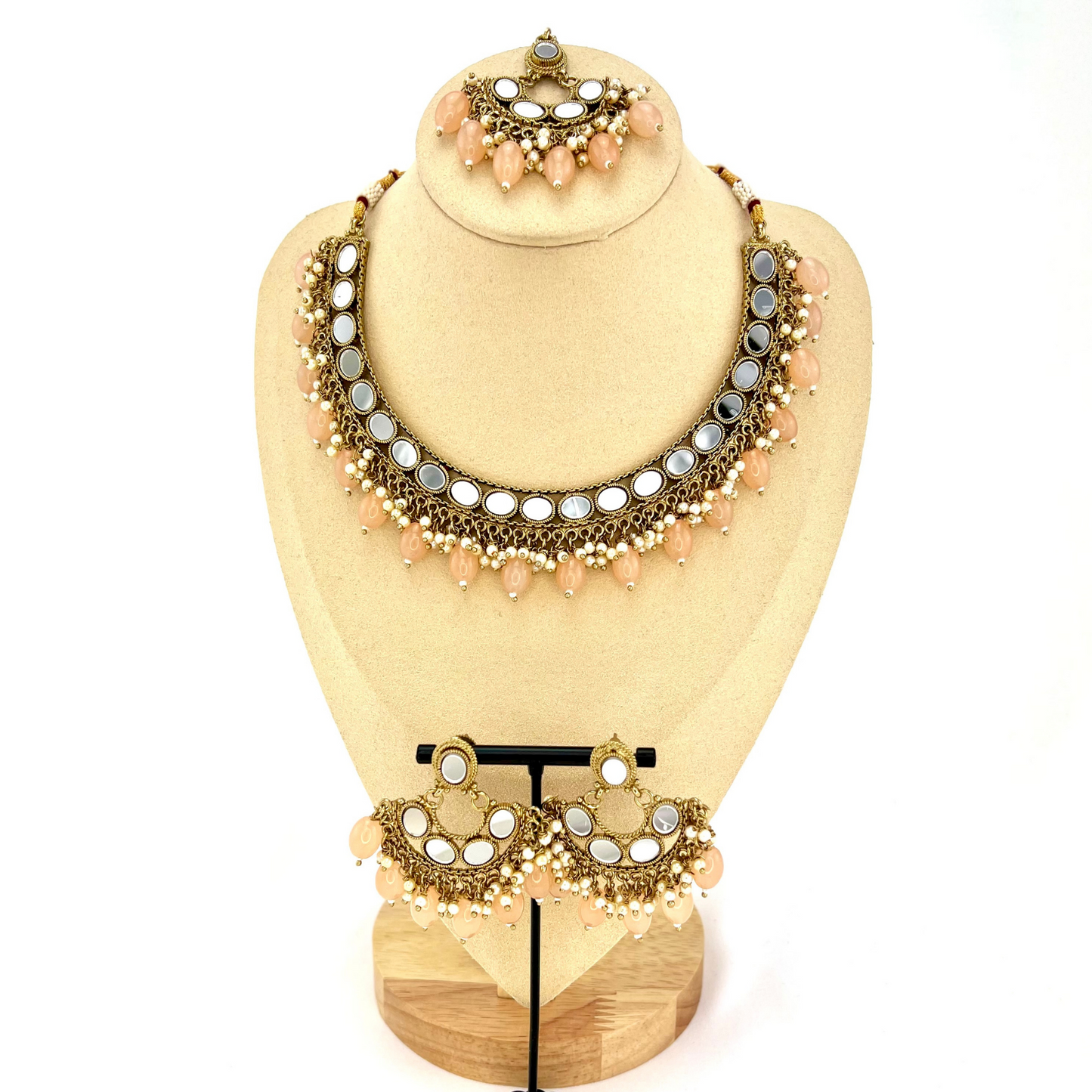 Mirror necklace set with peach beads and small white pearls. Set includes necklace, tikka and earrings. Prefect for Indian parties, weddings and special occasions. Latest 2022 fashion.