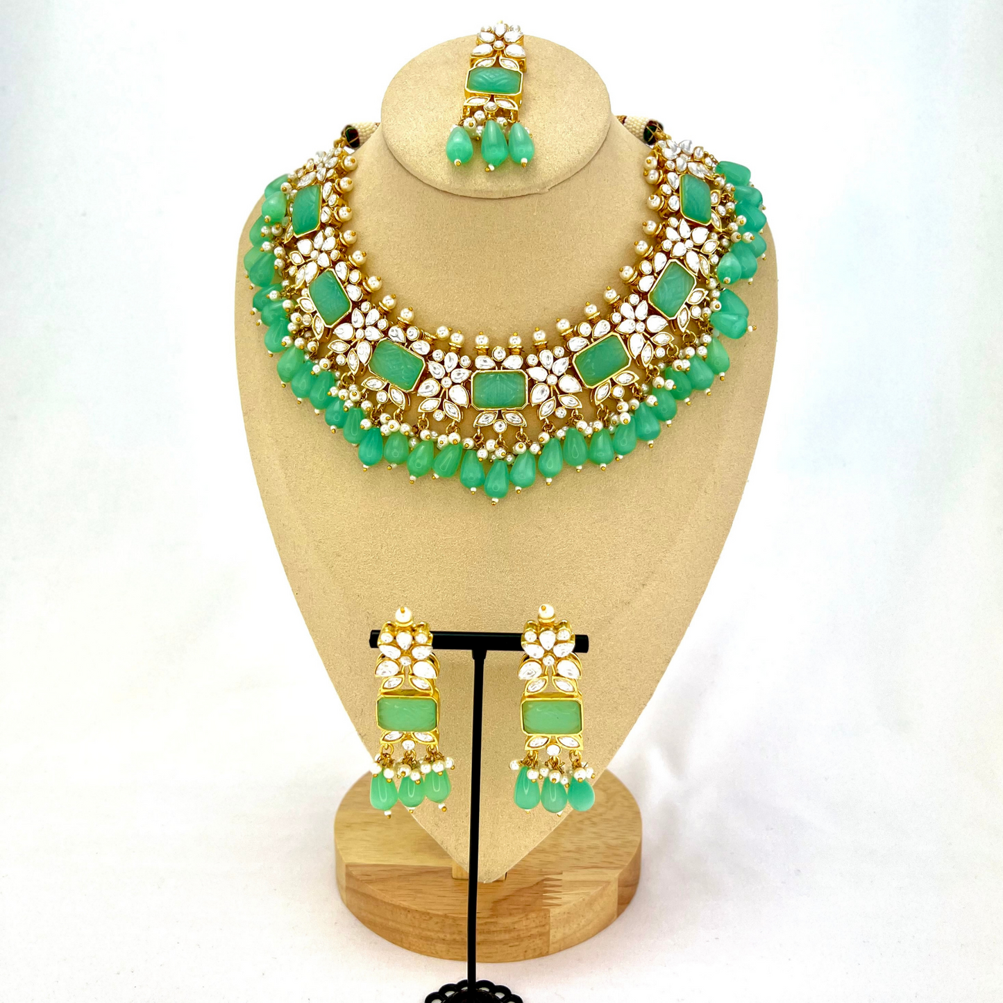 Necklace set with turquoise beads, clear and turquoise stones. Set includes necklace, tikka & earrings. Prefect for Indian weddings, parties and special occasions. Latest 2022 fashion. High end Indian fashion jewellery with top quality stones and beads.