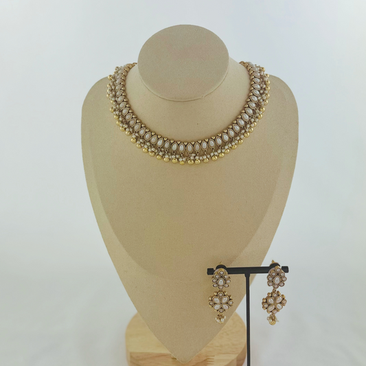 Necklace set with white pearl beads. Set includes necklace, tikka & earrings. Prefect for Indian weddings, parties and special occasions. Latest 2023 fashion. High end Indian fashion jewellery with top quality stones and beads.