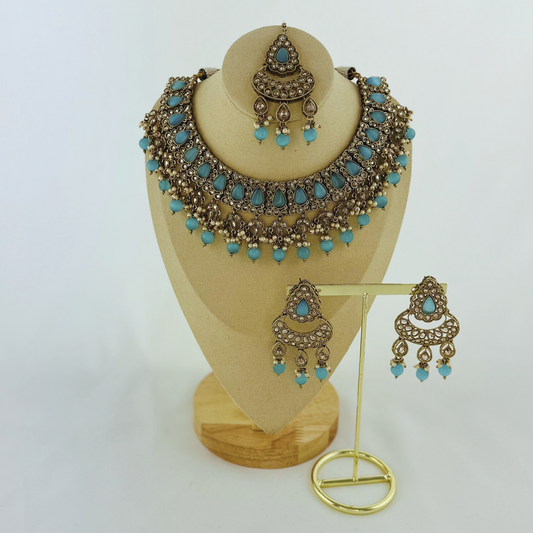 Necklace set with blue stones and beads. Set includes necklace, tikka & earrings. Prefect for Indian weddings, parties and special occasions. Latest 2023 fashion. High end Indian fashion jewellery with top quality stones and beads.