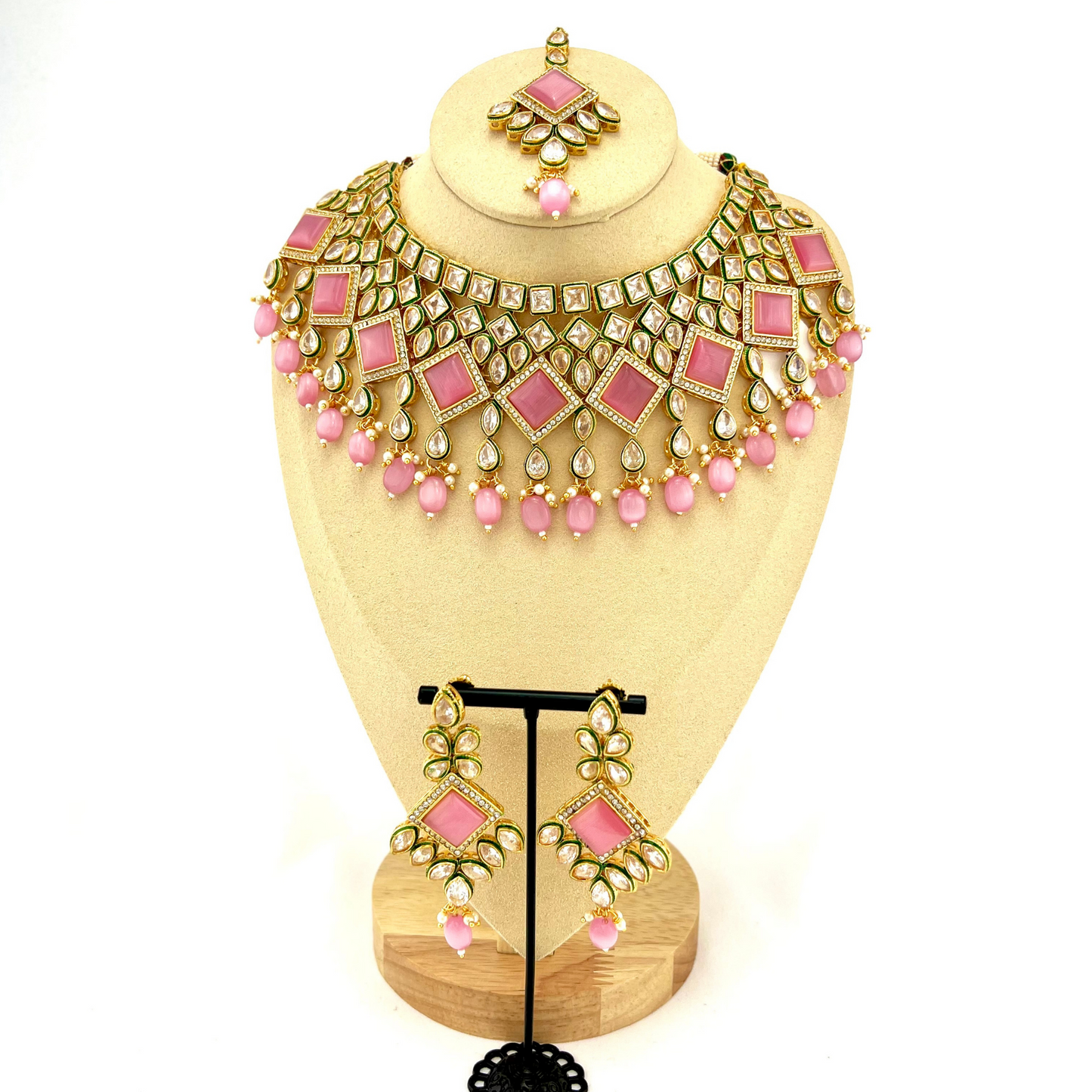 Necklace set with pink beads and pink and clear stone. Set includes necklace, tikka & earrings. Prefect for Indian weddings, parties and special occasions. Latest 2022 fashion. High end Indian fashion jewellery with top quality stones and beads.