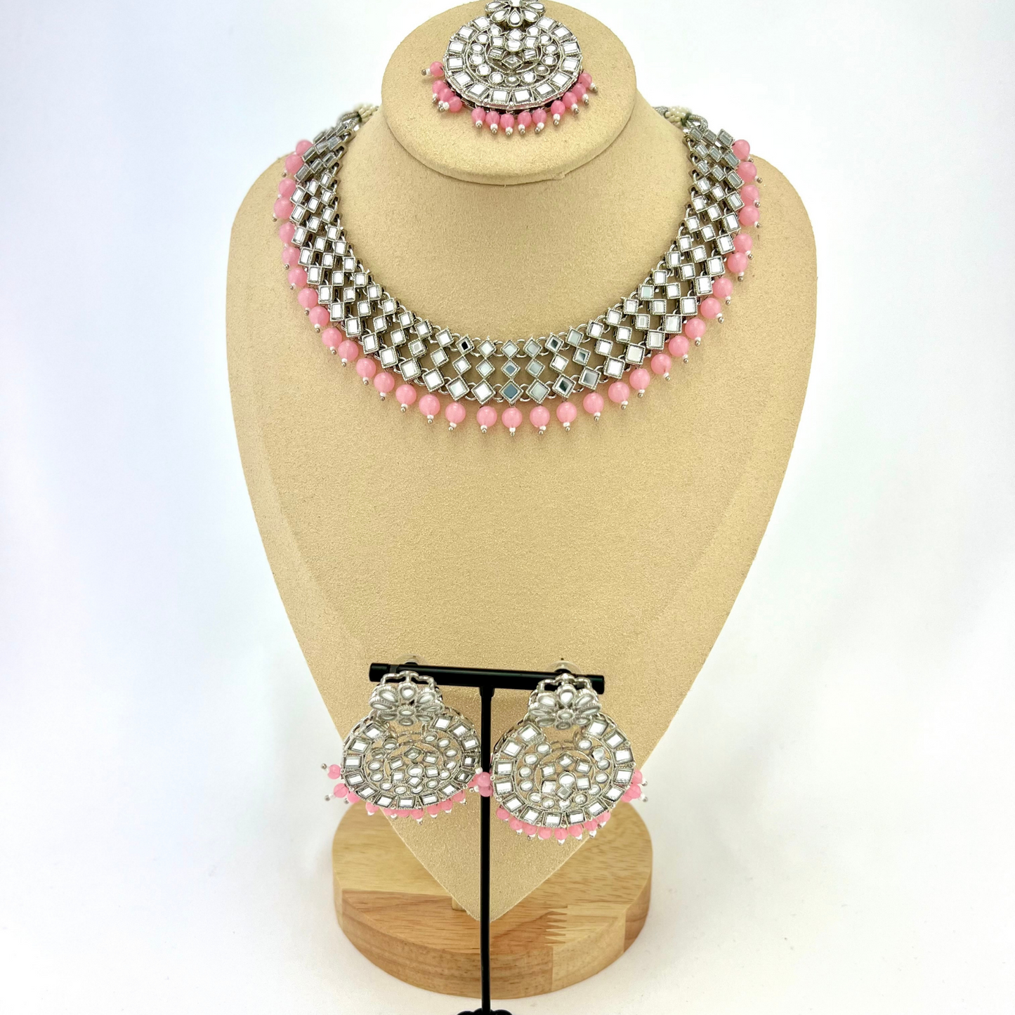 Mirror necklace set with baby pink beads. Set includes, necklace, tikka and earrings. Prefect for Indian weddings, parties and special occasions. Latest 2022 fashion. High end Indian fashion jewellery with top quality stones and beads.