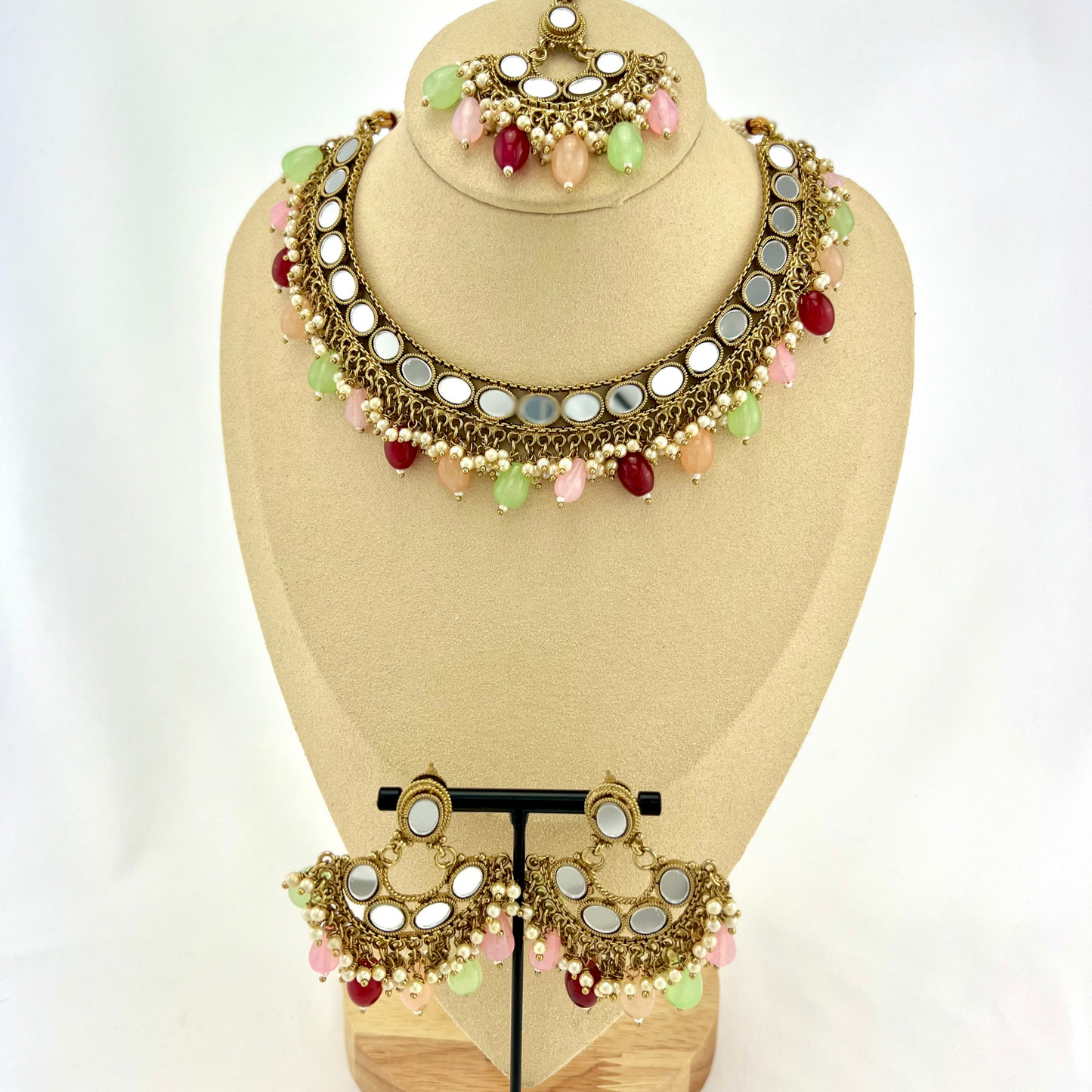 Mirror necklace set with multi colour beads and small white pearls. Set includes necklace, tikka and earrings. Prefect for Indian parties, weddings and special occasions. Latest 2022 fashion.