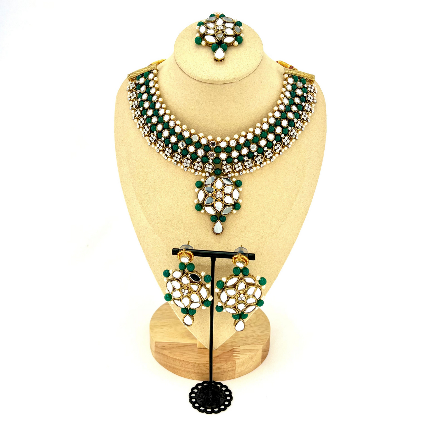 Mirror necklace set with forest green beads, clear stones and pearls. Set includes, necklace, tikka and earrings. Prefect for Indian weddings, parties and special occasions. Latest 2022 fashion. High end Indian fashion jewellery with top quality stones and beads.