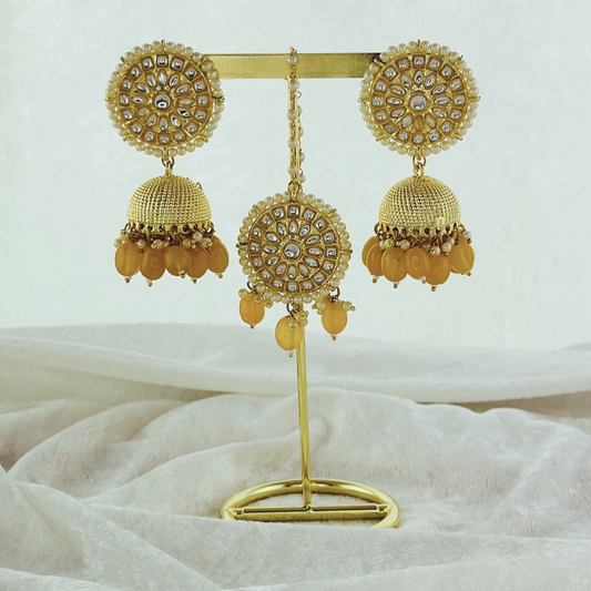 Tikka & earring set in yellow. High quality beads, pearls and stone work. Latest 2023 fashion for weddings, parties and special occasions