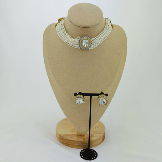 Necklace set with clear stone and white pearl beads. Set includes necklace & earrings. Prefect for Indian weddings, parties and special occasions. Latest 2023 fashion. High end Indian fashion jewellery with top quality stones and beads.