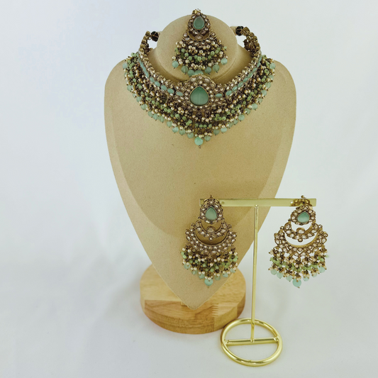Choker set with aqua blue stones pearl beads. Set includes necklace, tikka & earrings. Prefect for Indian weddings, parties and special occasions. Latest 2023 fashion. High end Indian fashion jewellery with top quality stones and beads.
