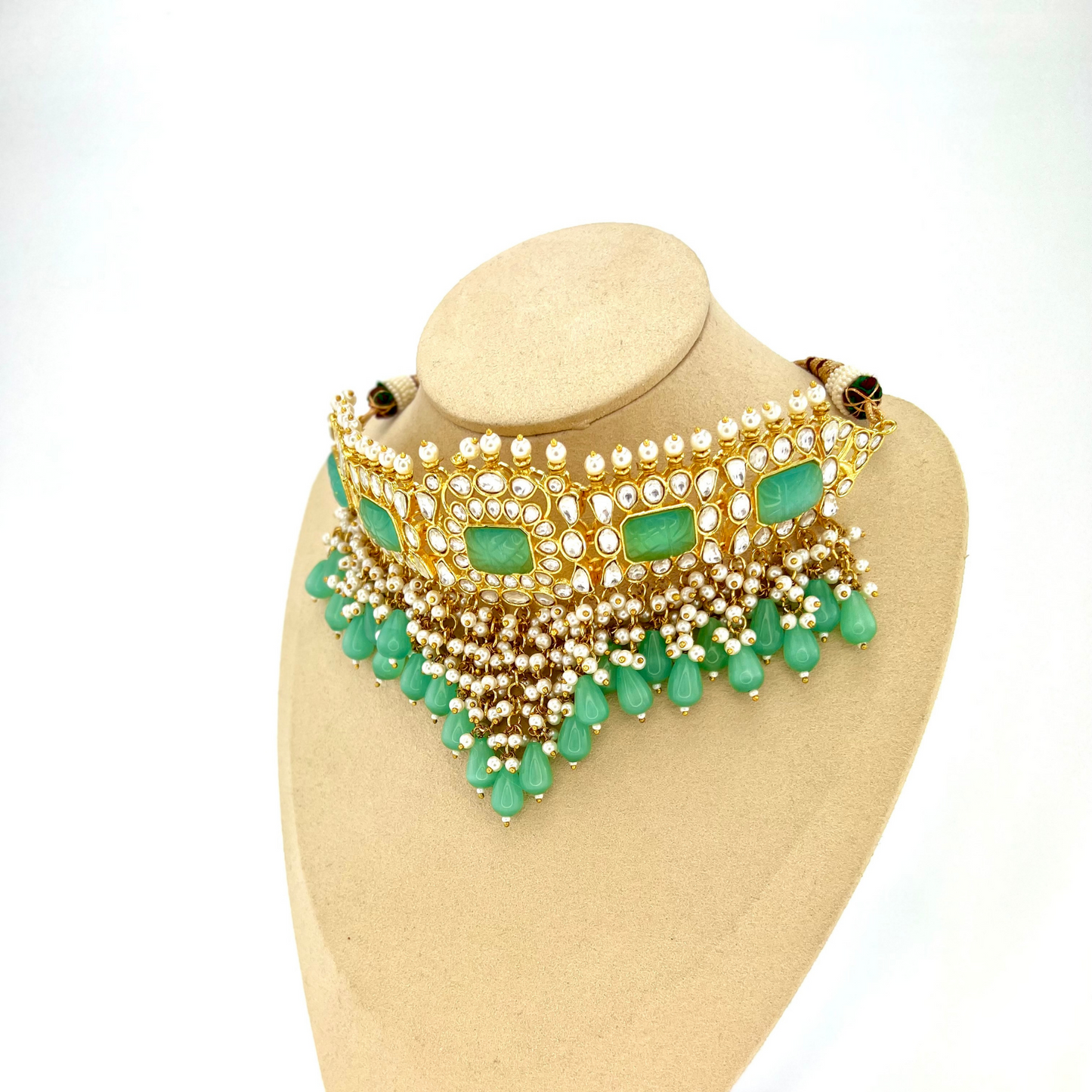Necklace set with turquoise beads and stones, finished with small white pearls. Set includes necklace, tikka and earrings. Prefect for Indian weddings, parties and special occasions. Latest 2022 fashion. High end Indian fashion jewellery with top quality stones and beads.