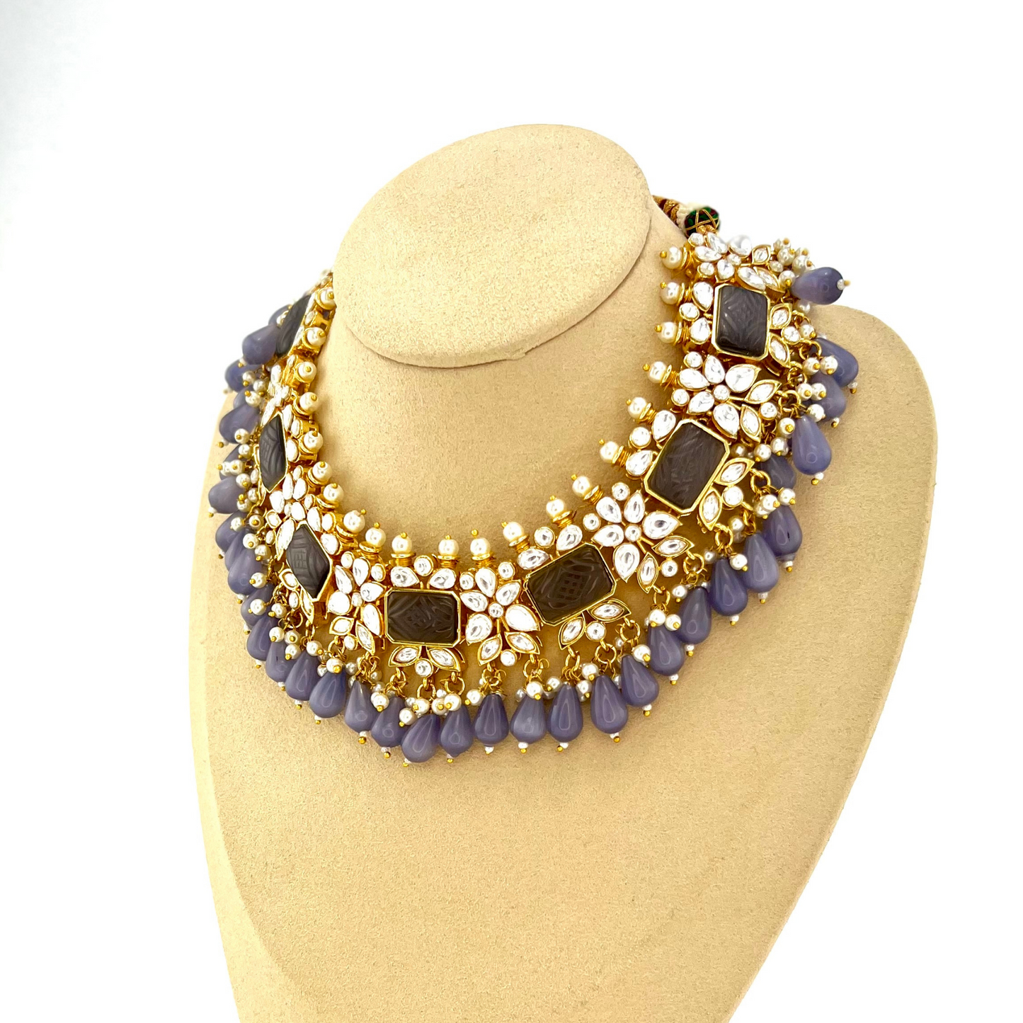 Necklace set with lavender beads, clear and lavender stones. Set includes necklace, tikka & earrings. Prefect for Indian weddings, parties and special occasions. Latest 2022 fashion. High end Indian fashion jewellery with top quality stones and beads.