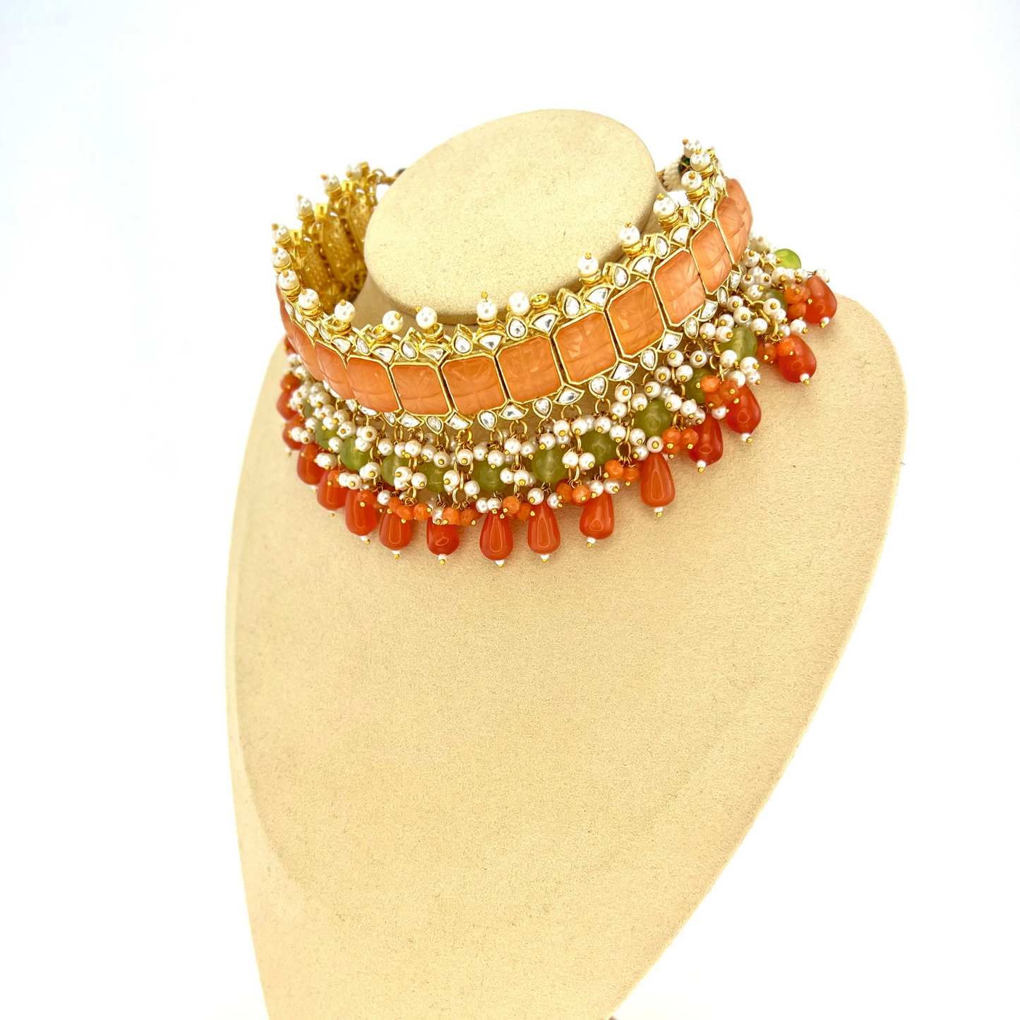 Choker set with with peach, clear stones and green, peach and orange beads, Set includes choker, tikka and earrings. Prefect for Indian weddings, parties and special occasions. Latest 2022 fashion. High end Indian fashion jewellery with top quality stones and beads.