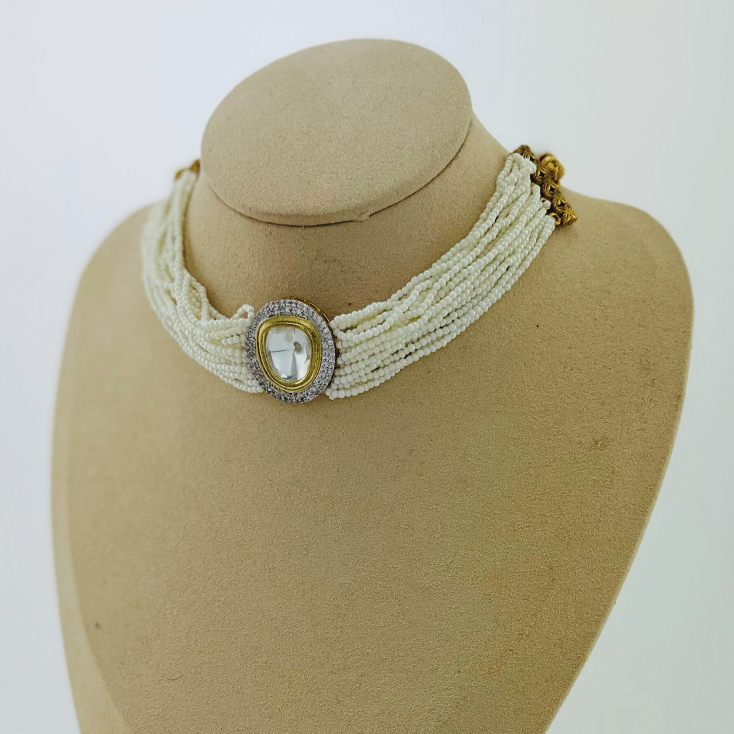 Necklace set with clear stone and white pearl beads. Set includes necklace & earrings. Prefect for Indian weddings, parties and special occasions. Latest 2023 fashion. High end Indian fashion jewellery with top quality stones and beads.