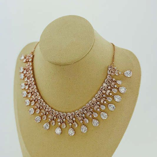 Rosegold necklace set with clear white stones. Set includes necklace & earrings. Prefect for Indian weddings, parties and special occasions. Latest 2023 fashion. High end Indian fashion jewellery with top quality stones and beads.