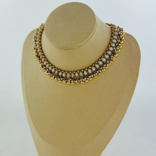 Necklace set with white pearl beads. Set includes necklace, tikka & earrings. Prefect for Indian weddings, parties and special occasions. Latest 2023 fashion. High end Indian fashion jewellery with top quality stones and beads.