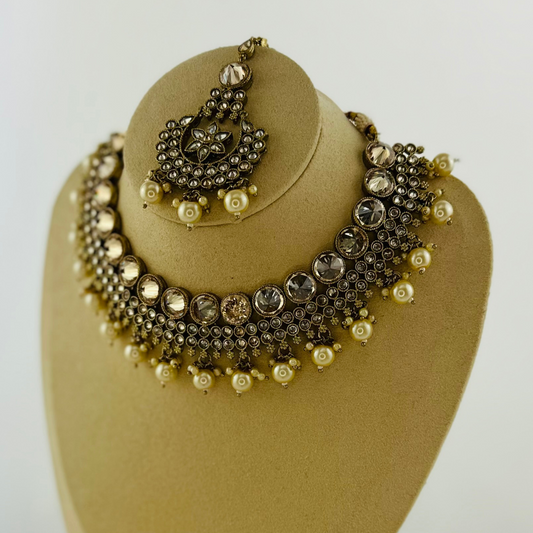 Necklace set with white pearl beads. Set includes necklace, tikka & earrings. Prefect for Indian weddings, parties and special occasions. Latest 2023 fashion. High end Indian fashion jewellery with top quality stones and beads.