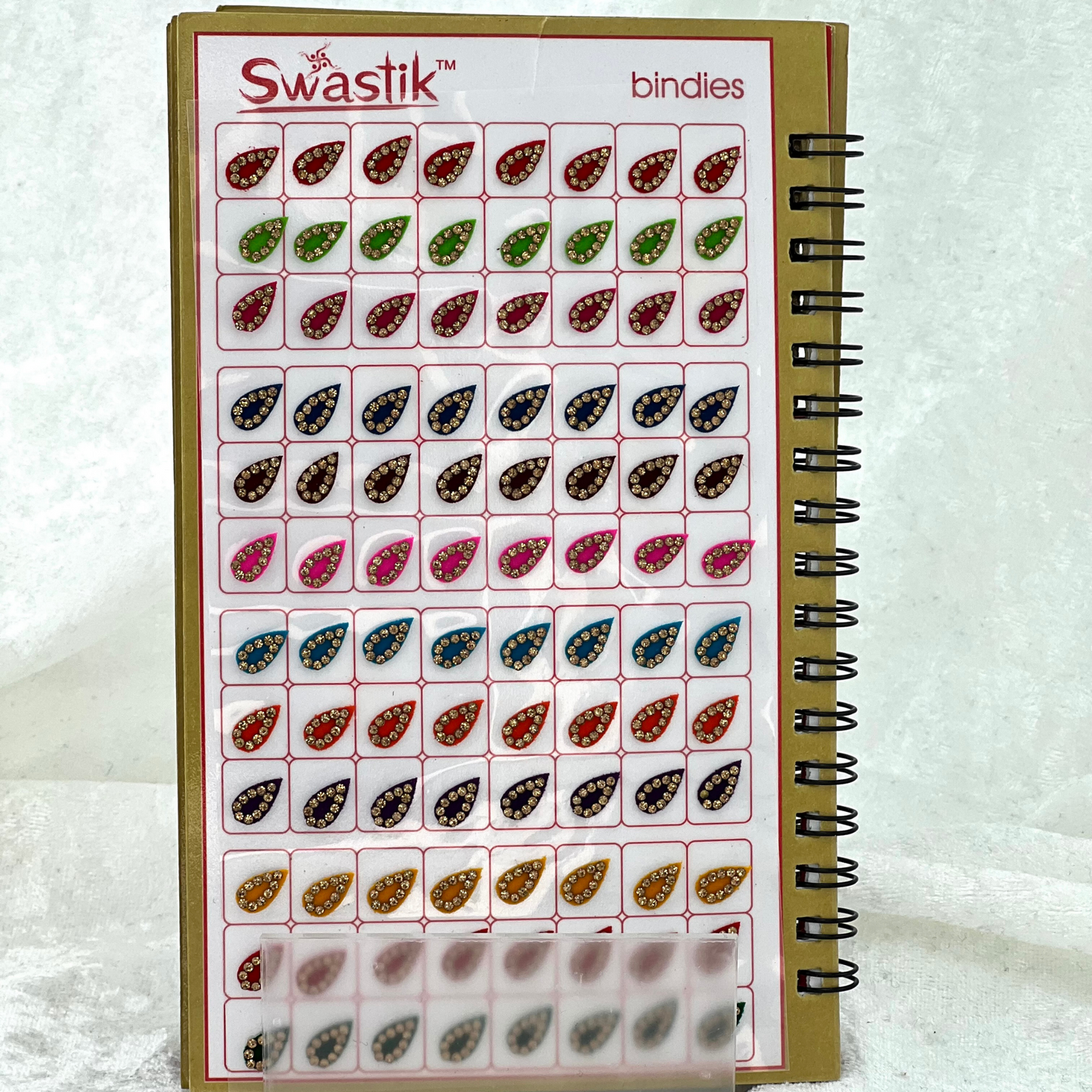Bindi Book with gold stone work in various different shapes, sizes and colours. Prefect for Indian weddings, parties and special occasions.