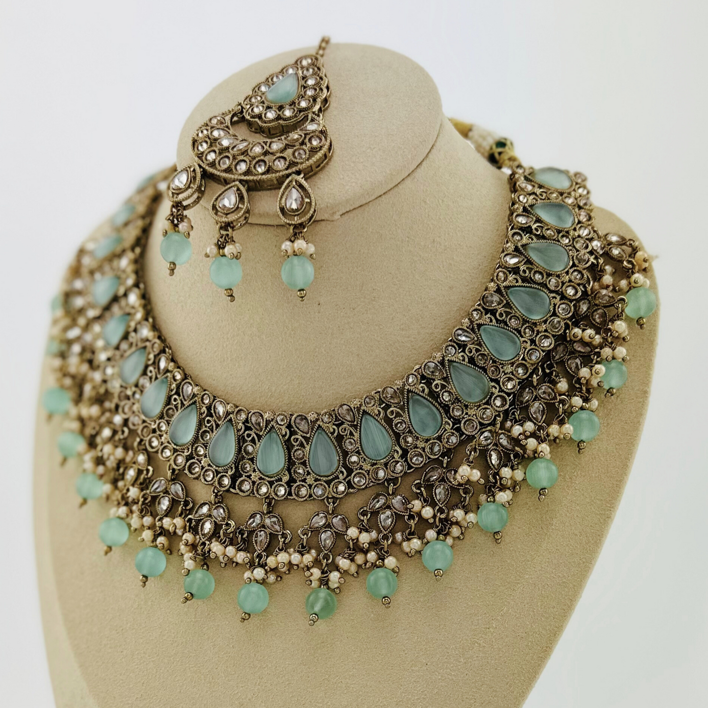 Necklace set with light blue beads and stone. Set includes necklace, tikka & earrings. Prefect for Indian weddings, parties and special occasions. Latest 2023 fashion. High end Indian fashion jewellery with top quality stones and beads.