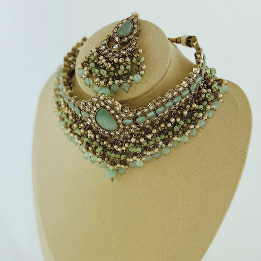 Choker set with aqua blue stones pearl beads. Set includes necklace, tikka & earrings. Prefect for Indian weddings, parties and special occasions. Latest 2023 fashion. High end Indian fashion jewellery with top quality stones and beads.