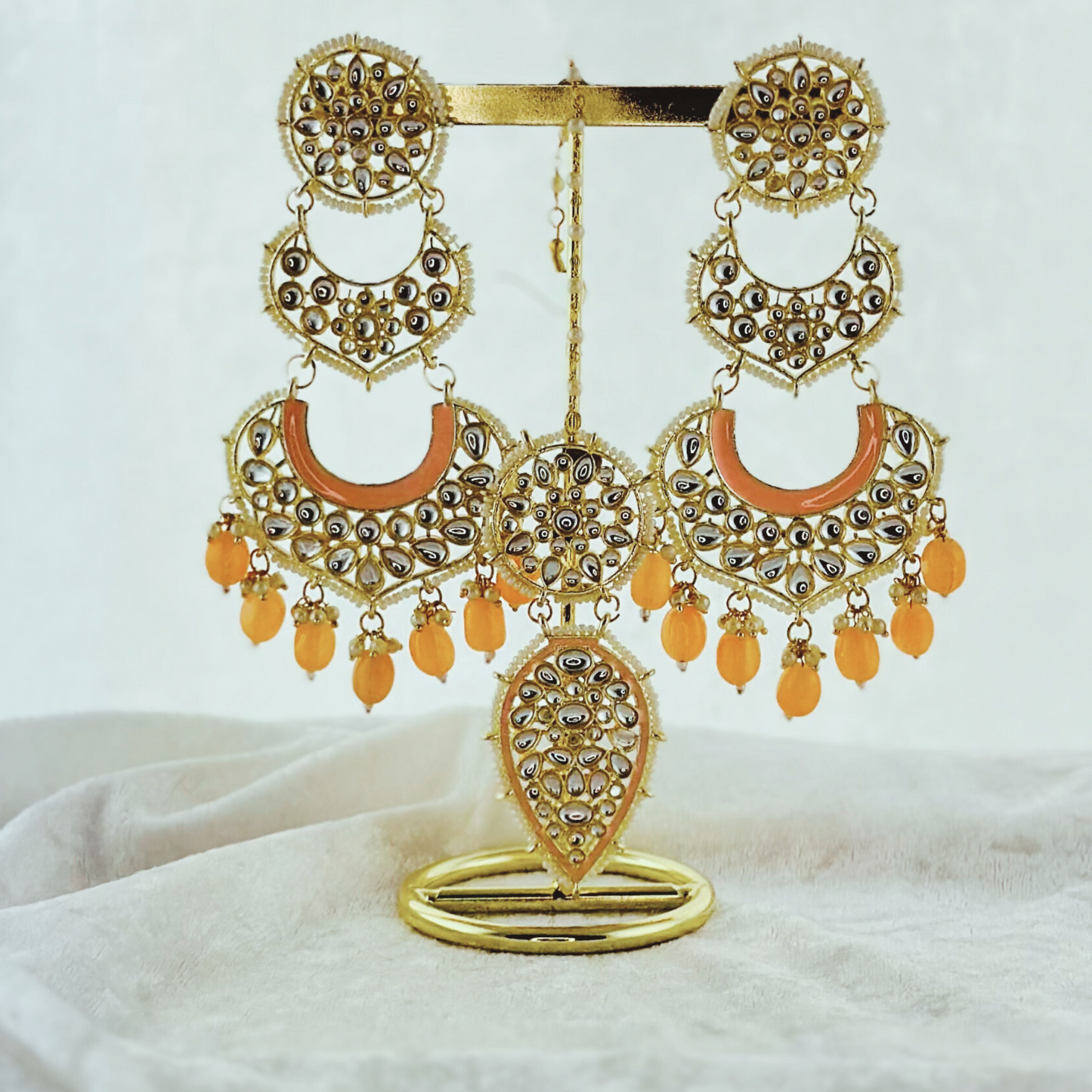 Tikka & Earring Set in peach. High quality beads, pearls and stone work. Latest 2023 fashion for weddings, parties and special occasions