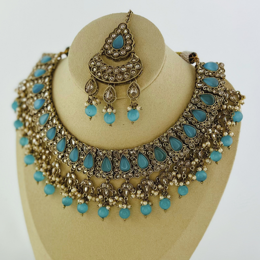 Necklace set with blue stones and beads. Set includes necklace, tikka & earrings. Prefect for Indian weddings, parties and special occasions. Latest 2023 fashion. High end Indian fashion jewellery with top quality stones and beads.