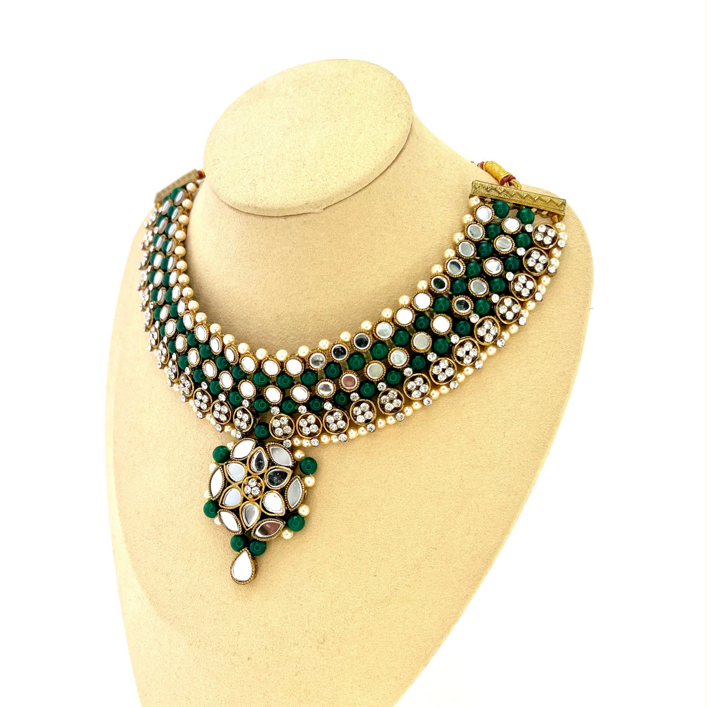 Mirror necklace set with forest green beads, clear stones and pearls. Set includes, necklace, tikka and earrings. Prefect for Indian weddings, parties and special occasions. Latest 2022 fashion. High end Indian fashion jewellery with top quality stones and beads.
