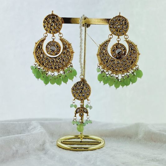 Tikka & earring set in green. High quality beads, pearls and stone work. Latest 2023 fashion for weddings, parties and special occasions