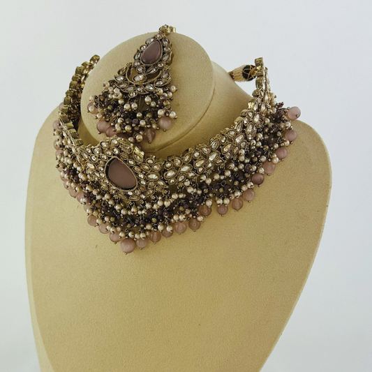 Choker set with lilac stones pearl beads. Set includes necklace, tikka & earrings. Prefect for Indian weddings, parties and special occasions. Latest 2023 fashion. High end Indian fashion jewellery with top quality stones and beads.