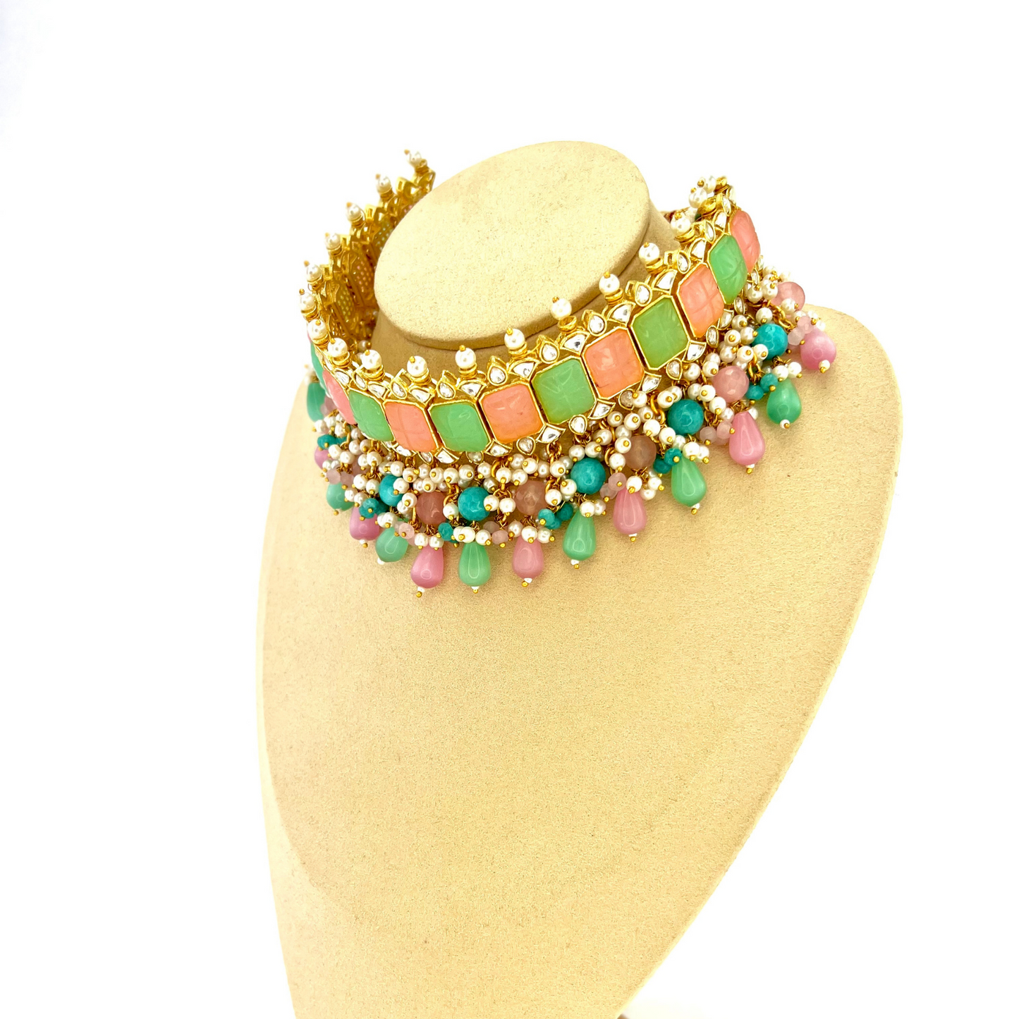 Choker set with with pink, green, clear stones and green, pink and blue beads. Set includes choker, tikka and earrings. Prefect for Indian weddings, parties and special occasions. Latest 2022 fashion. High end Indian fashion jewellery with top quality stones and beads.