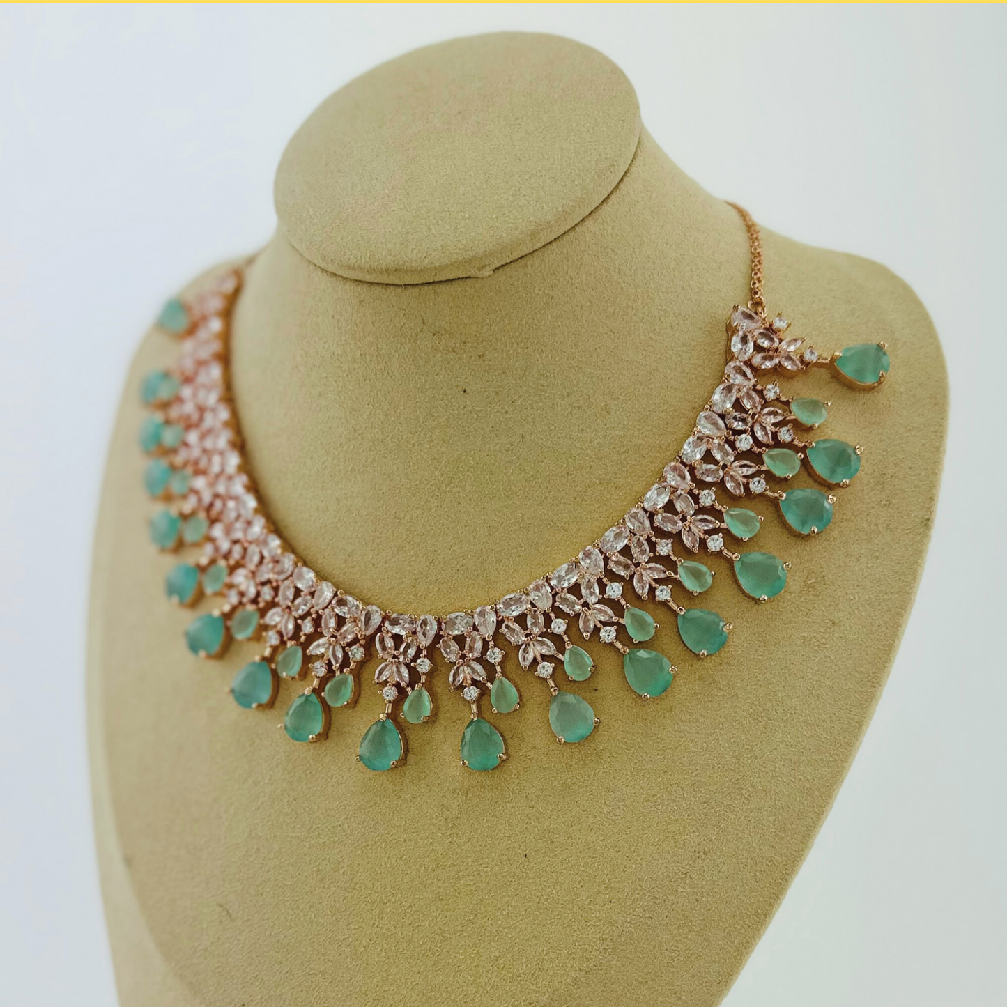 Rosegold necklace set with light blue and clear stones. Set includes necklace & earrings. Prefect for Indian weddings, parties and special occasions. Latest 2023 fashion. High end Indian fashion jewellery with top quality stones and beads.