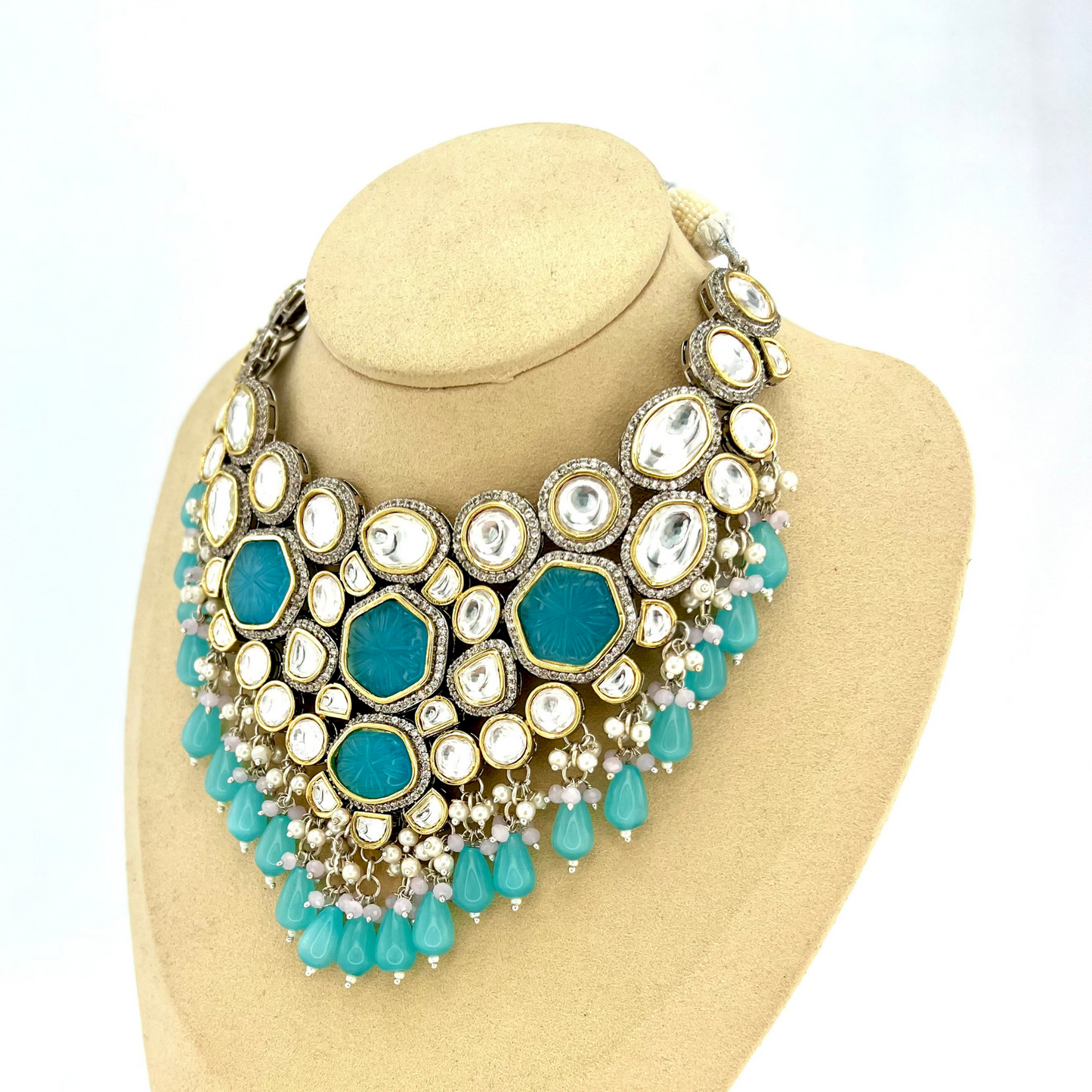 Kundan necklace set with with clear and blue stones, blue beads and small white pearls. Set includes necklace and earrings. Prefect for Indian weddings, parties and special occasions. Latest 2022 fashion. High end Indian fashion jewellery with top quality stones and beads.