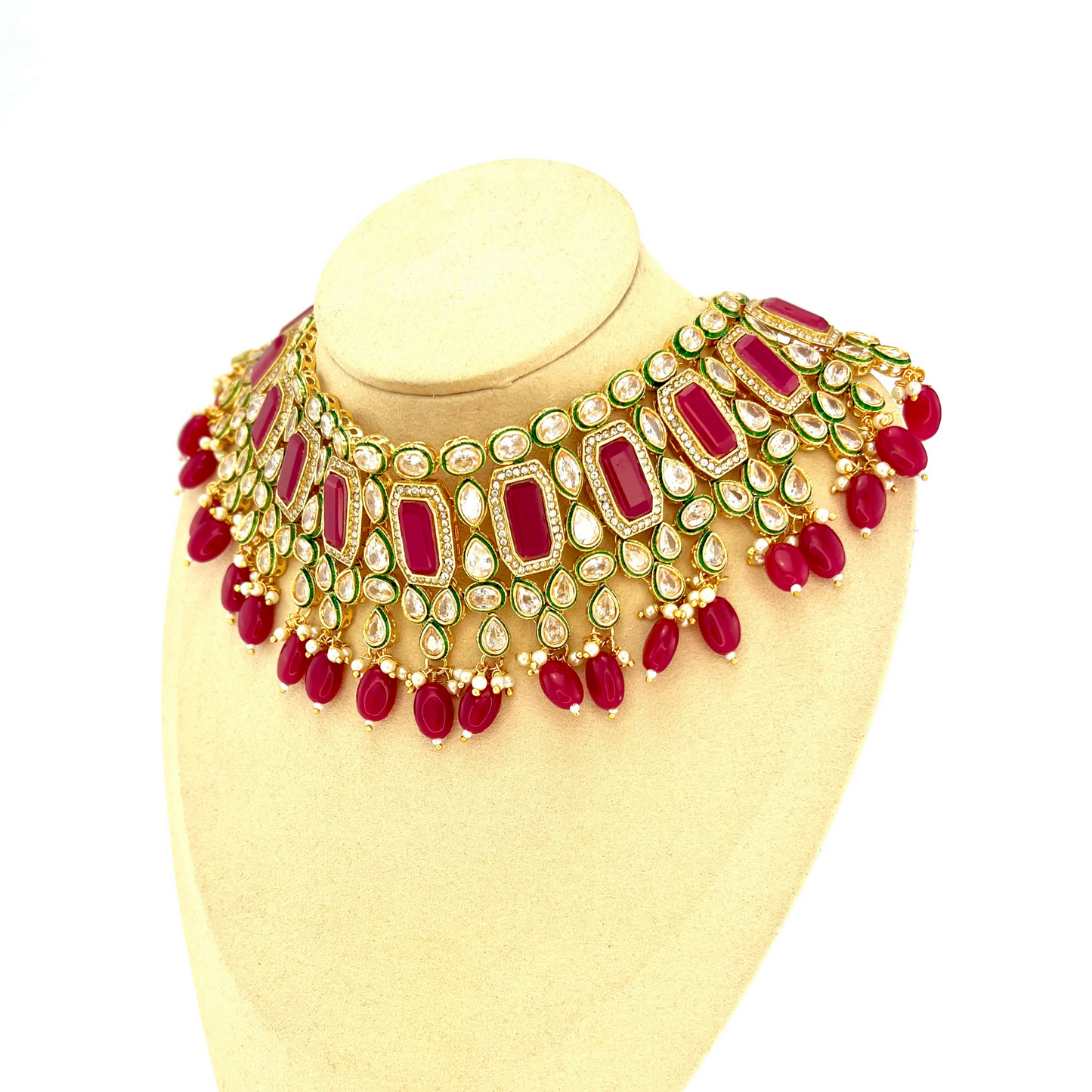 Necklace set with hot pink beads and clear and hot pink stones. Set includes necklace, tikka and earrings. Prefect for Indian weddings, parties and special occasions. Latest 2022 fashion. High end Indian fashion jewellery with top quality stones and beads.