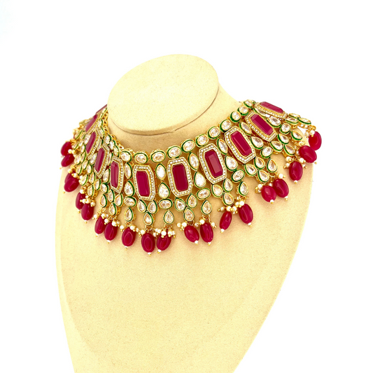 Necklace set with hot pink beads and clear and hot pink stones. Set includes necklace, tikka and earrings. Prefect for Indian weddings, parties and special occasions. Latest 2022 fashion. High end Indian fashion jewellery with top quality stones and beads.