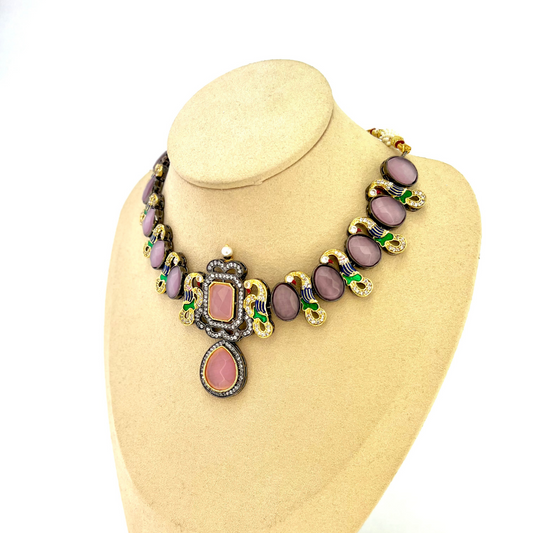 Necklace set with pink and purple clear stone work. Set includes necklace and earrings. Prefect for Indian weddings, parties and special occasions. Latest 2022 fashion. High end Indian fashion jewellery with top quality stones and beads.