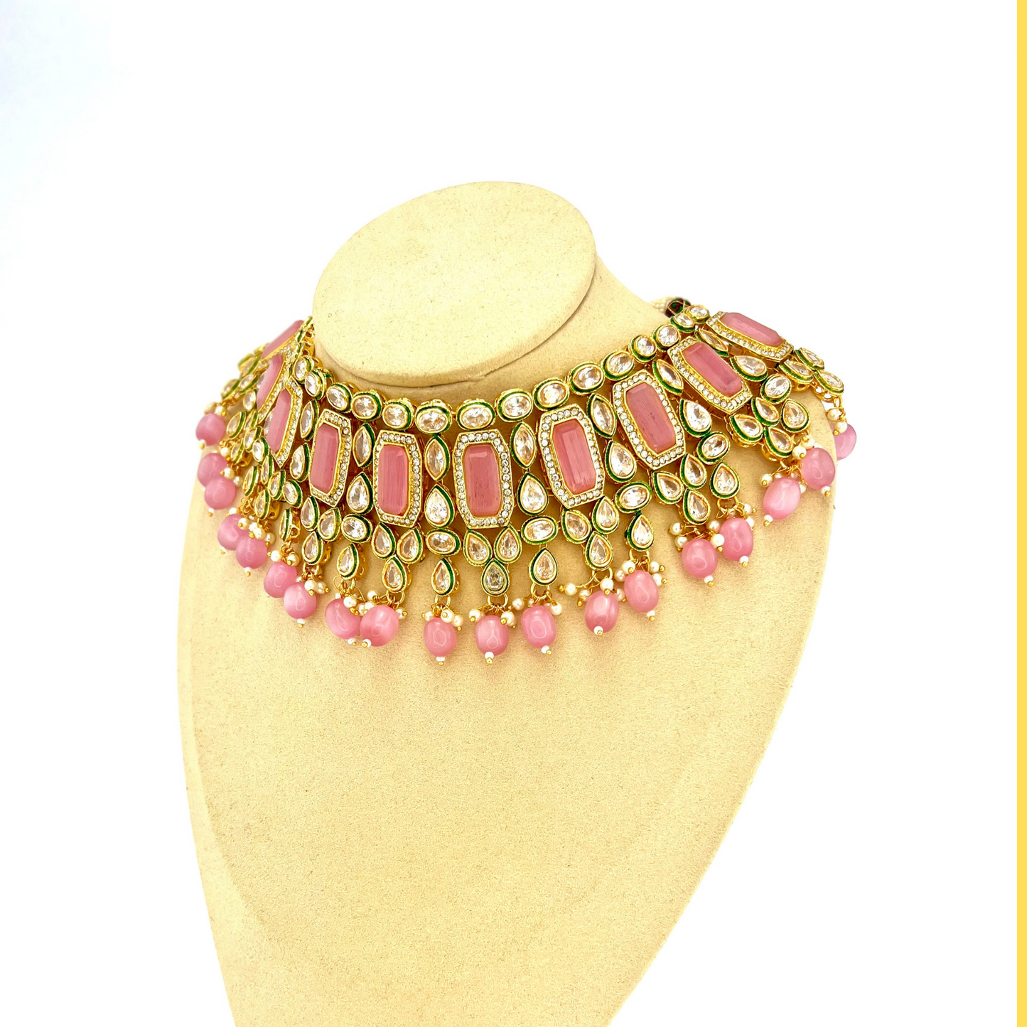 Necklace set with pink beads and clear and pink stones. Set includes necklace, tikka and earrings. Prefect for Indian weddings, parties and special occasions. Latest 2022 fashion. High end Indian fashion jewellery with top quality stones and beads.