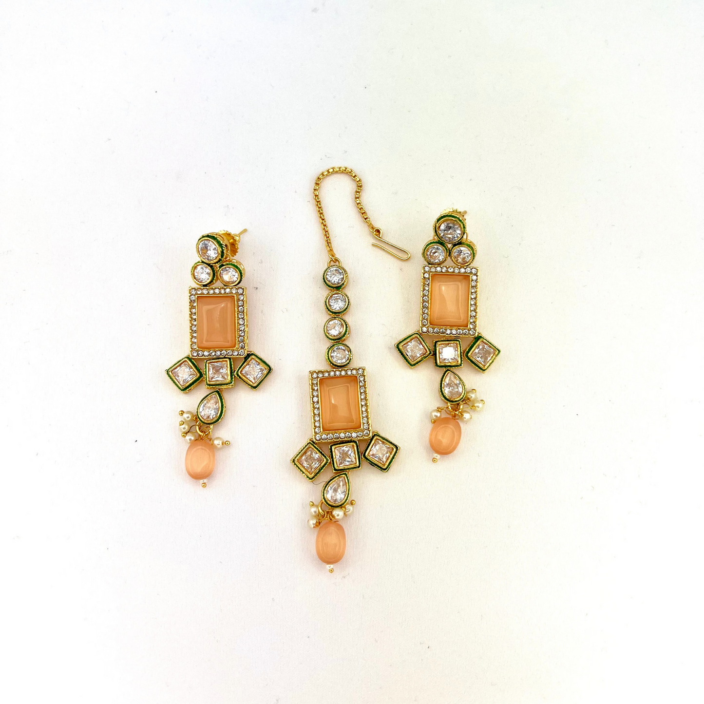 Necklace set with peach and clear stones and peach beads. Set includes necklace, tikka and earrings. Prefect for Indian weddings, parties and special occasions. Latest 2022 fashion. High end Indian fashion jewellery with top quality stones and beads.